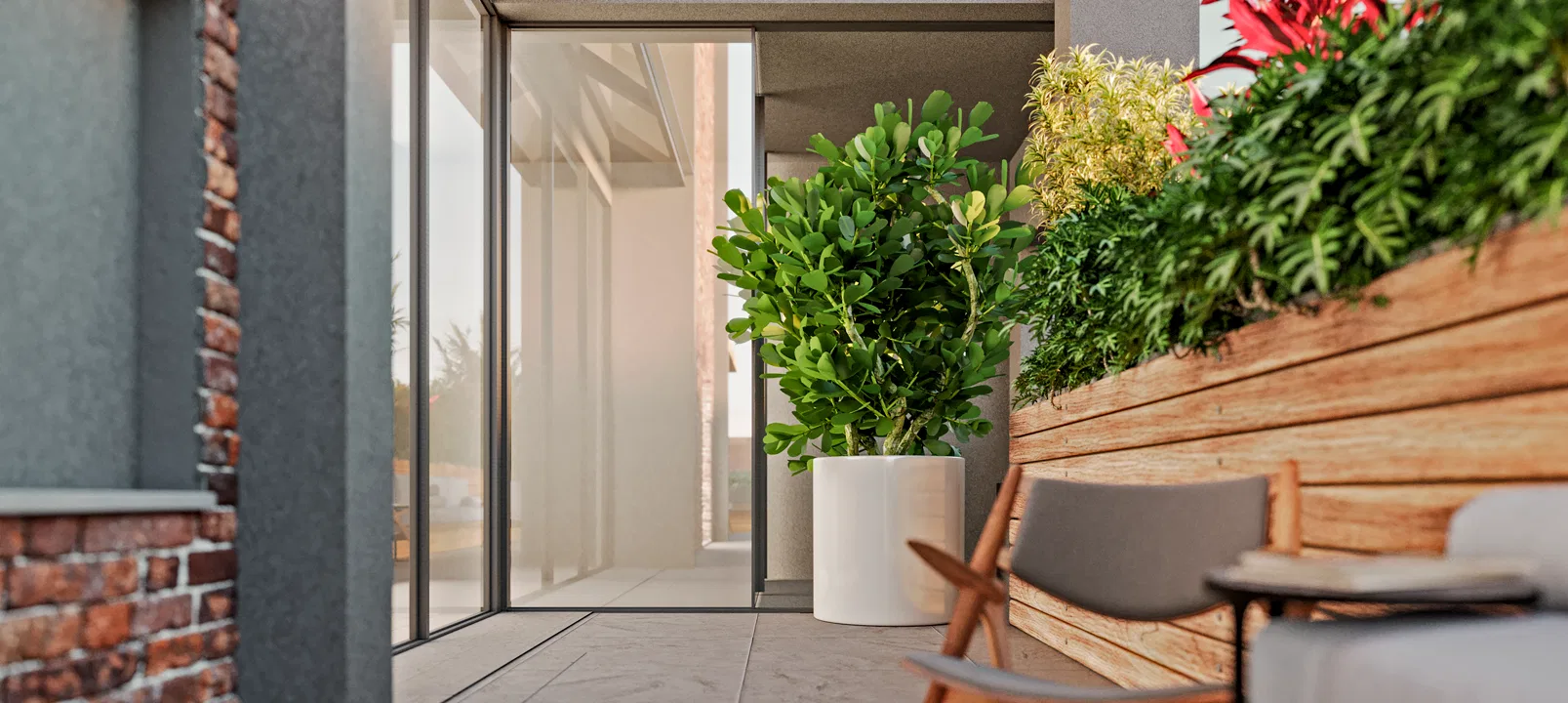Nook with an exposed-brick wall, a glass door to the interior, a fiddle-leaf fig in a white pot and a wooden planter of foliage beside a teak chair.
