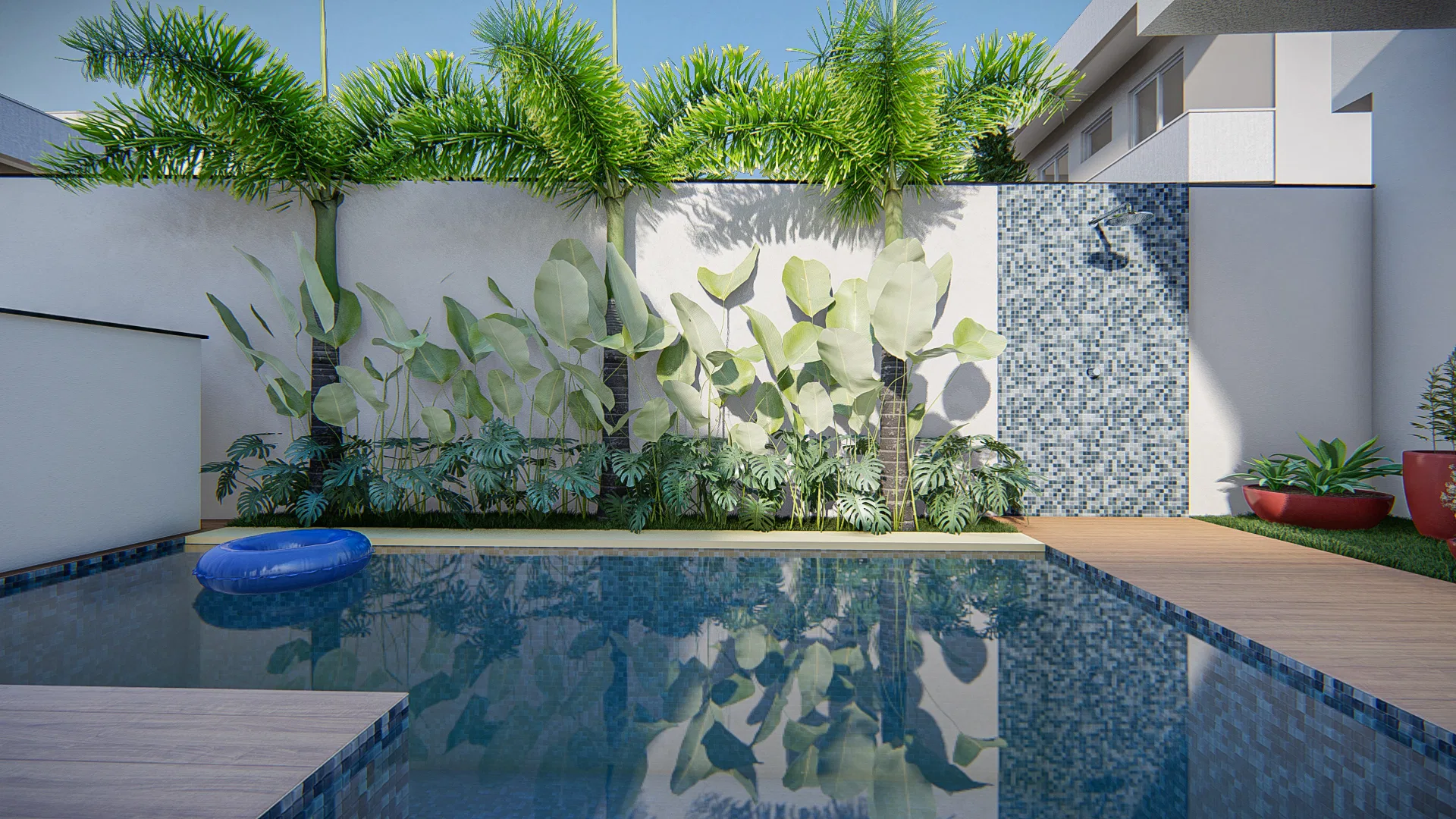 Pool with a blue-tiled edge and a mosaic panel with a shower, white walls dressed in foliage and a round float on the water.