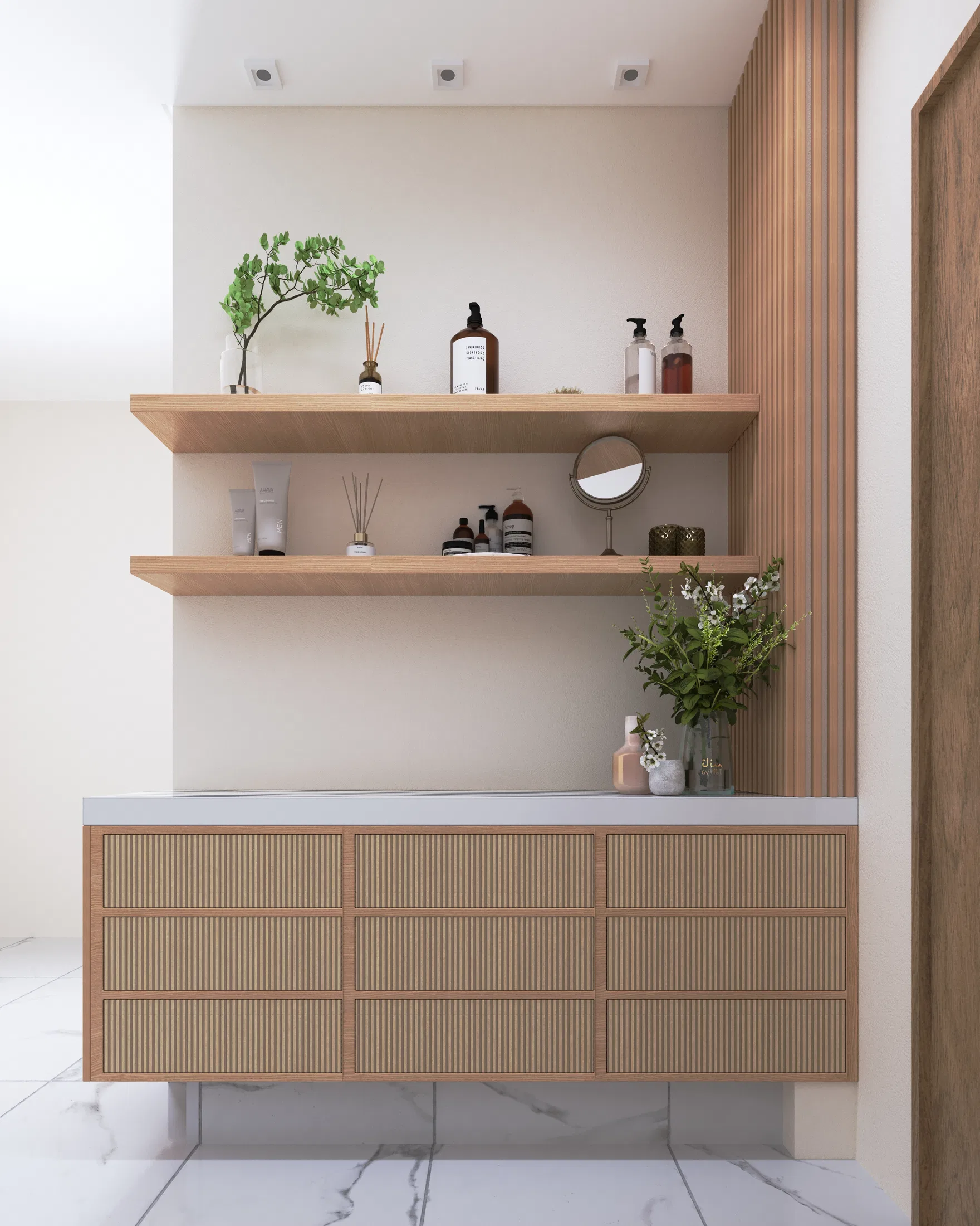 Bathroom detail with two wood shelves holding perfumery, a table mirror and plants, a slatted panel alongside and a fluted cabinet with a white top