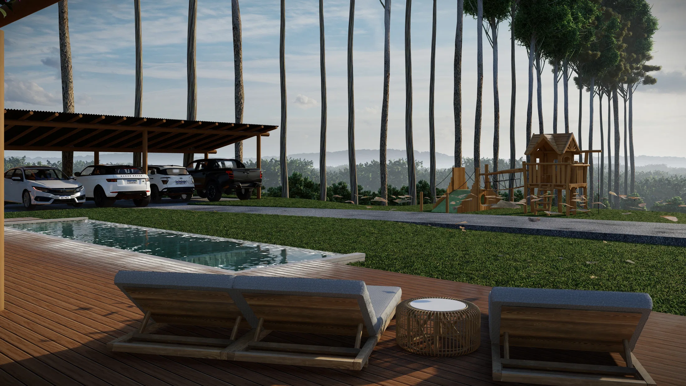 Loungers on the deck beside the pool, cars parked under a covered carport and a playground among pine trees
