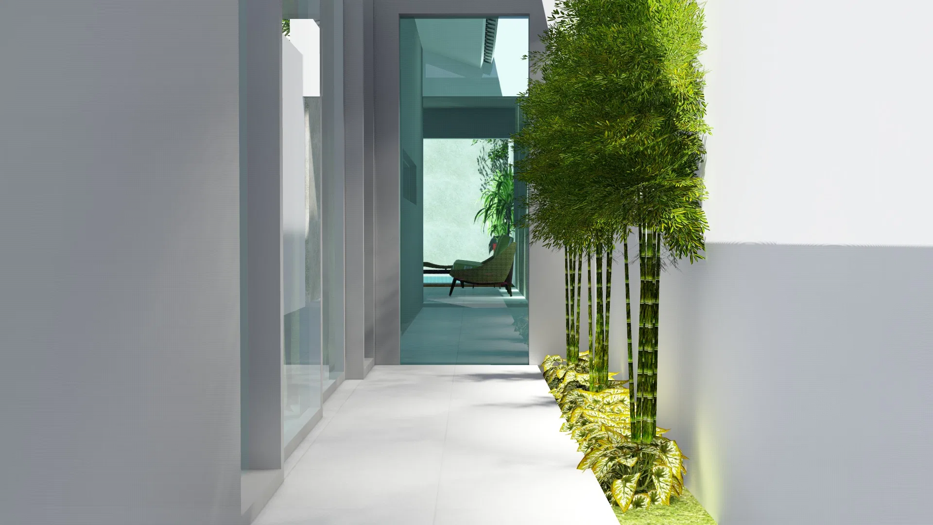 Circulation corridor with a glass wall on one side and a bed of golden bamboo lit by embedded floor lighting on the other