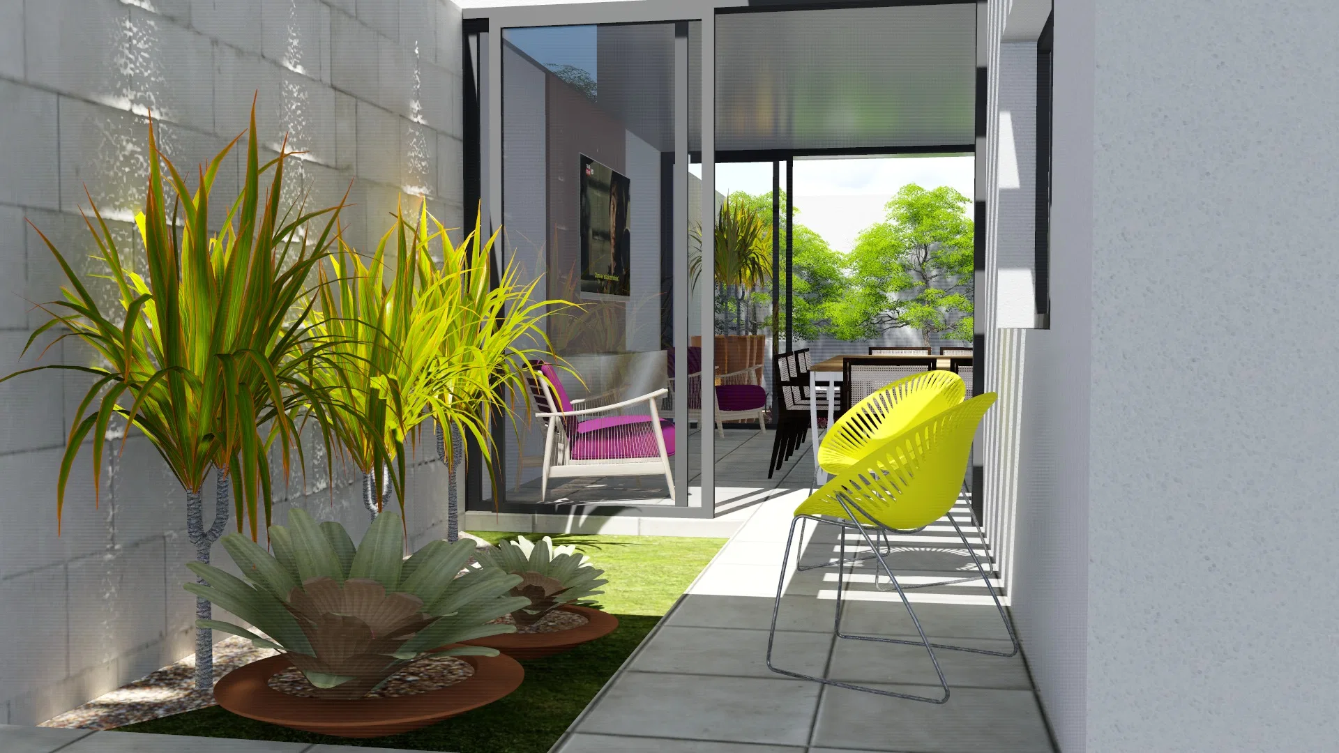 Inner patio by the block wall, with a vivid yellow chair, dracaenas and agaves in copper bowls over the lawn