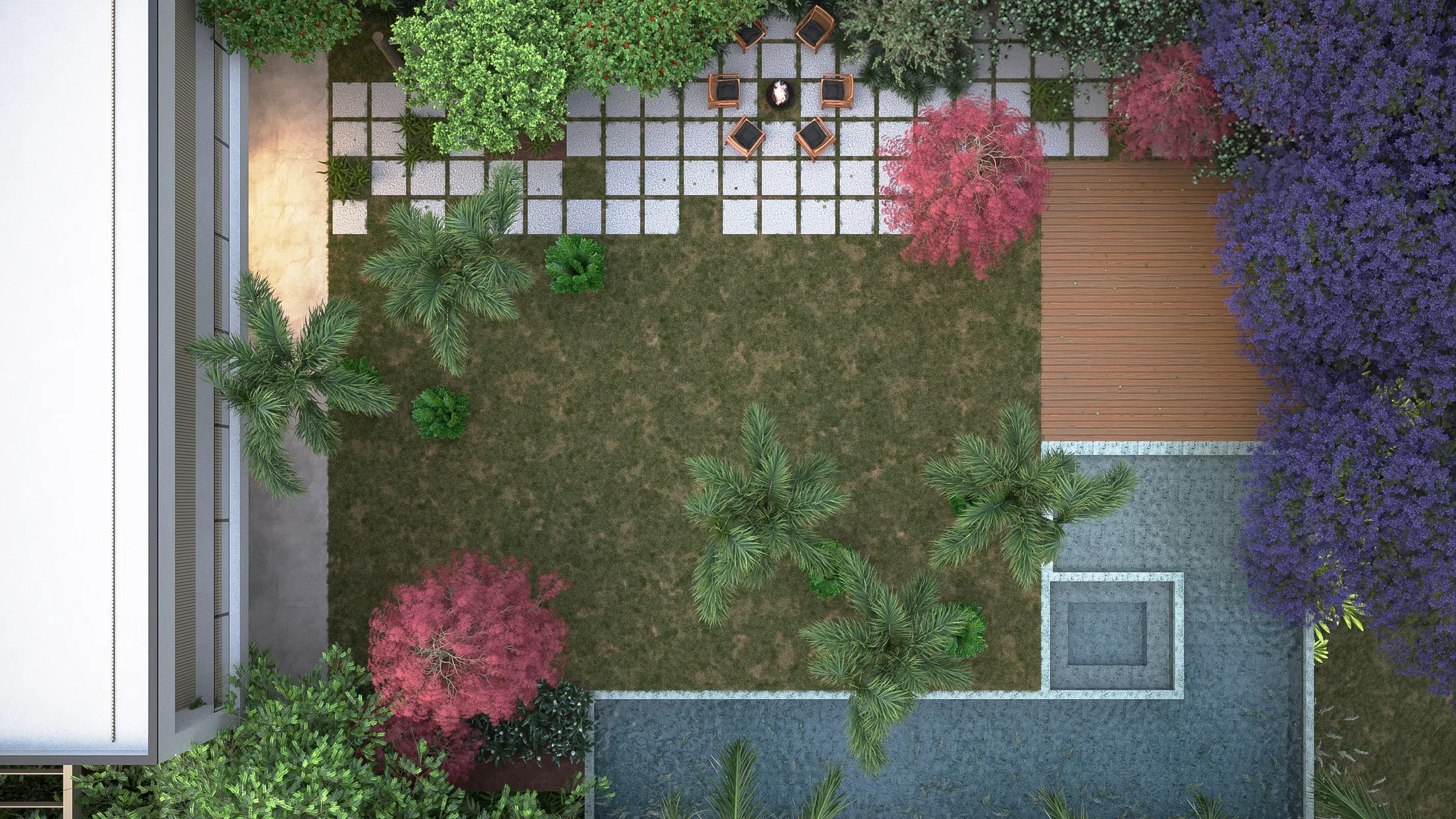 Top-down view of the rear garden with lawn, scattered palms and pines, pink-canopied trees, a timber deck and a pool in the corner