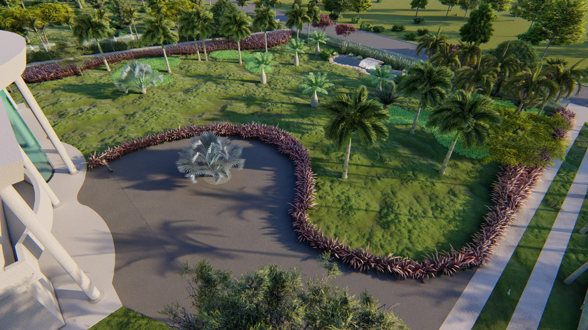 Elevated view of a teardrop water mirror with a central silver-palm island, edged by reddish grasses and a tree-dotted lawn.