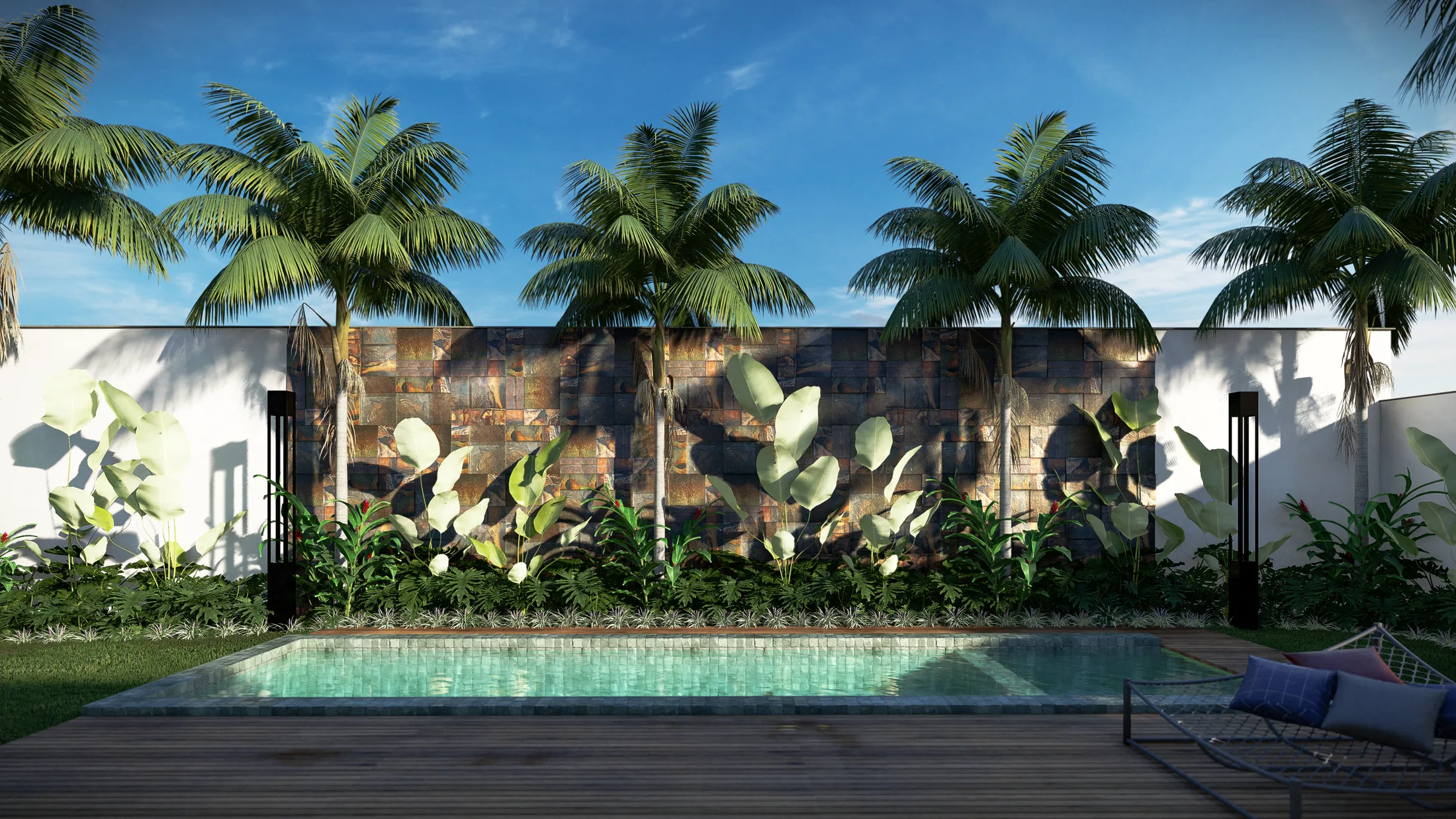 A lap pool with a timber deck facing a wall clad in oxidised metal panels, tall palms and tropical foliage under a blue sky.