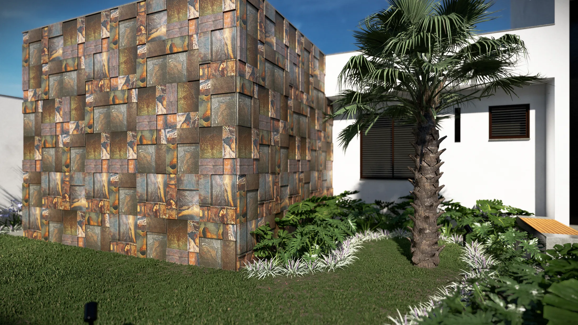 A volume clad in ferrous-stone mosaic beside a fan palm, trimmed lawn and a foliage bed against the white wall.