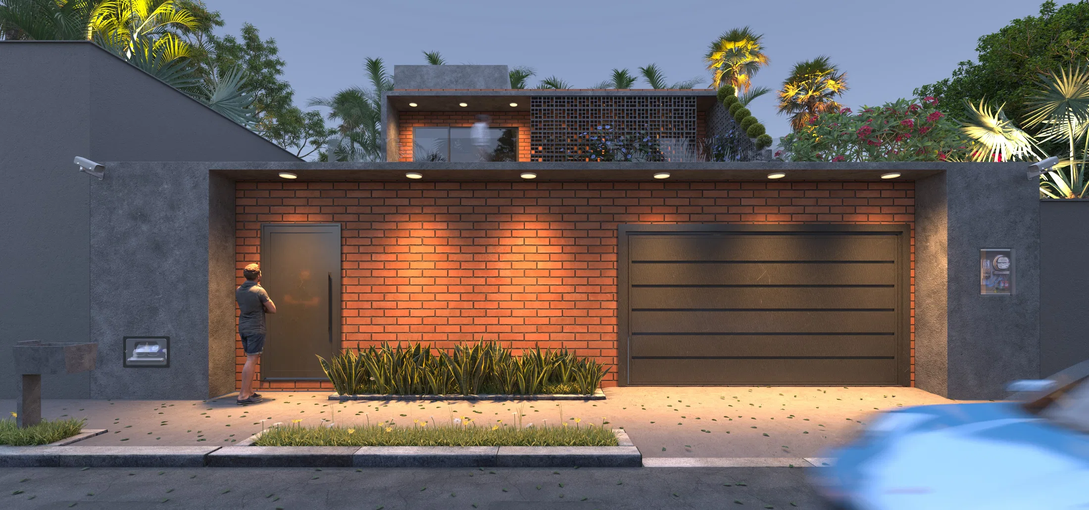 The same brick facade at dusk, with interior lights on and the dark garage under artificial lighting