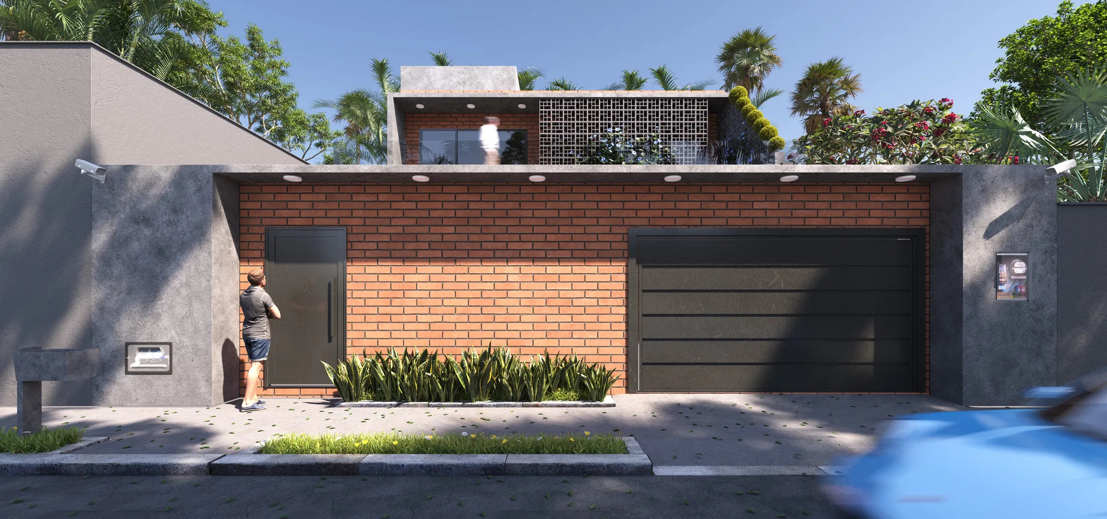 Daytime exposed-brick facade with a dark garage, a person by the pedestrian gate and a car passing on the street