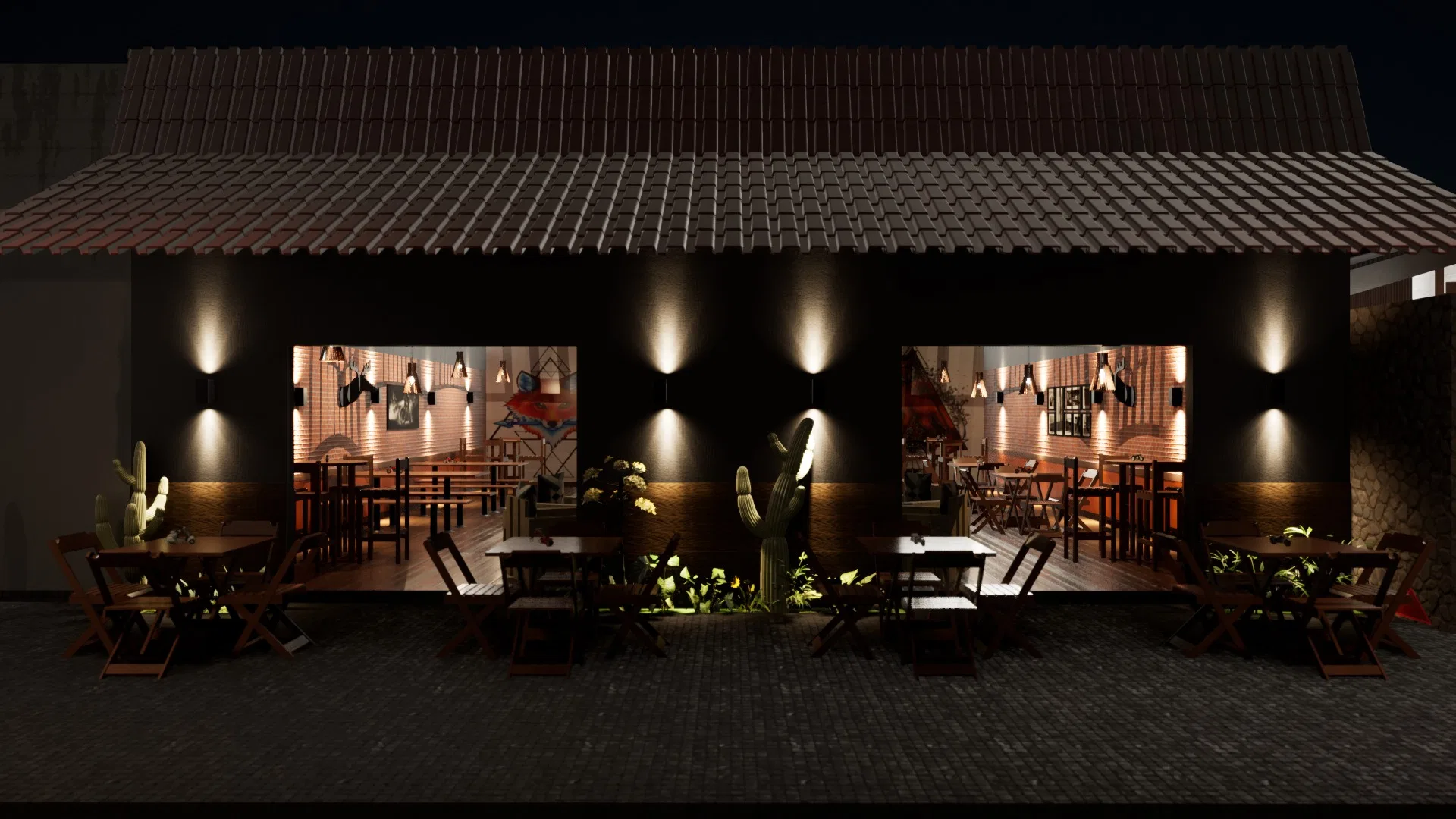 Front elevation at night with warm wall sconces, lit pendants and glowing interiors seen through the openings, among cacti and tables