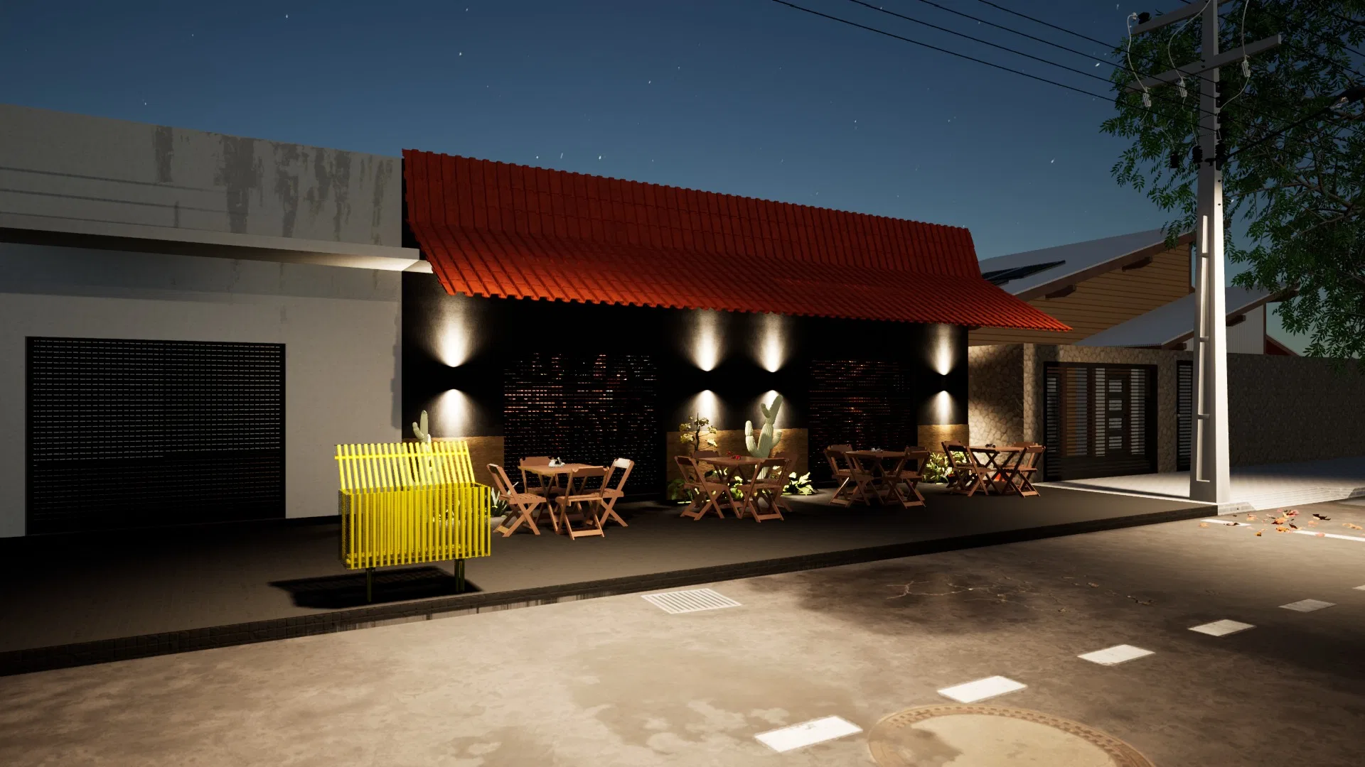 Night façade with a red ceramic-tile roof lit by wall sconces, a patio of wooden tables, a yellow bench and paving in the foreground