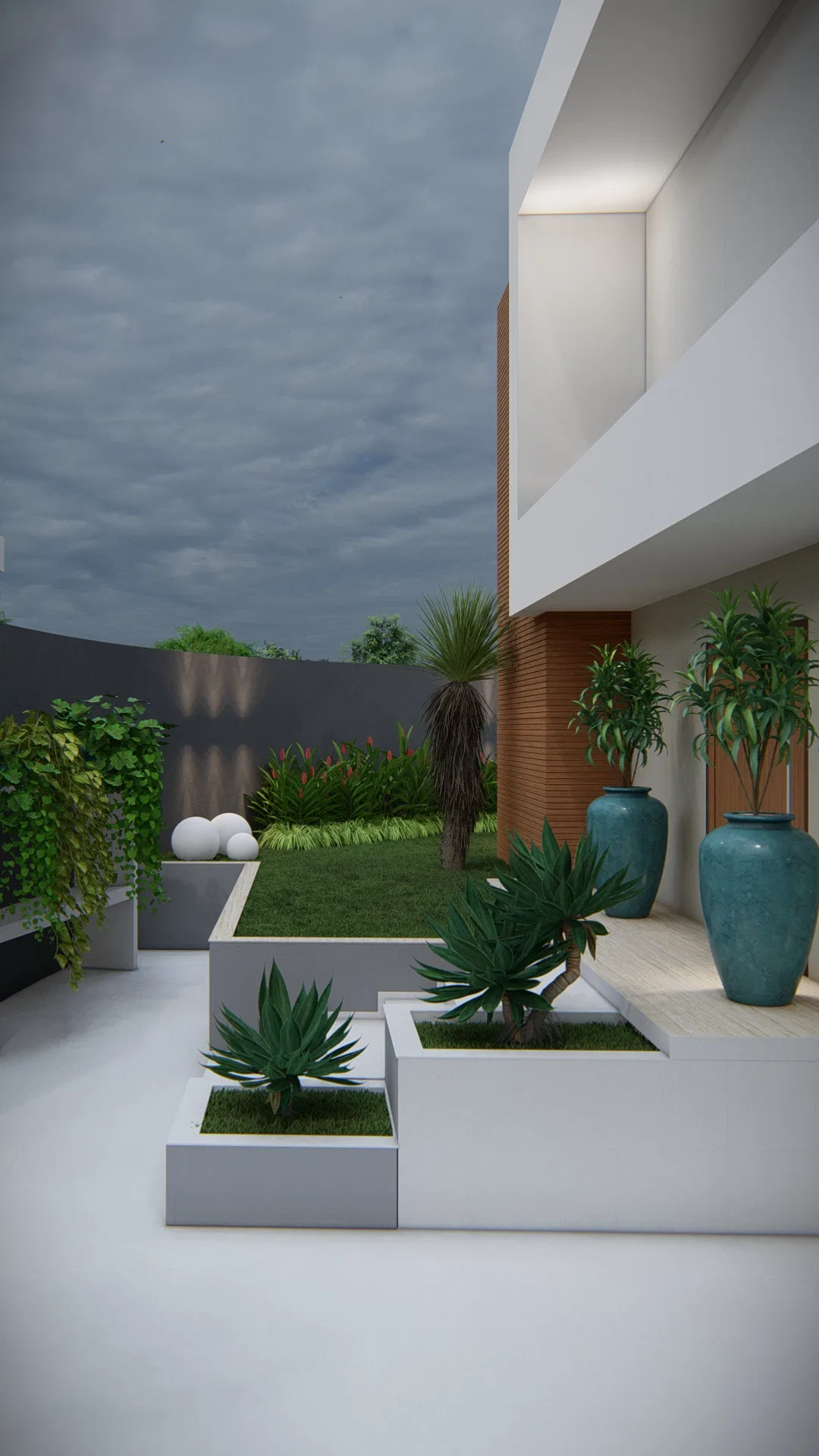 Side access corridor with blue urns, agave planters and a dark paved strip edged by planting