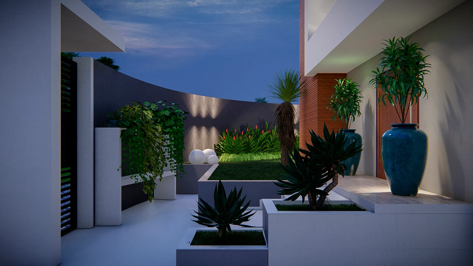 Inner courtyard at nightfall with white planters of agaves, large blue ceramic urns and a curved wall grazed by uplight