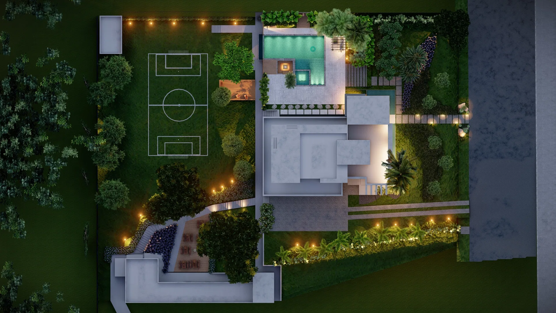 Top-down aerial view of the lot showing a sports court, pool, stone paths and illuminated gardens at night
