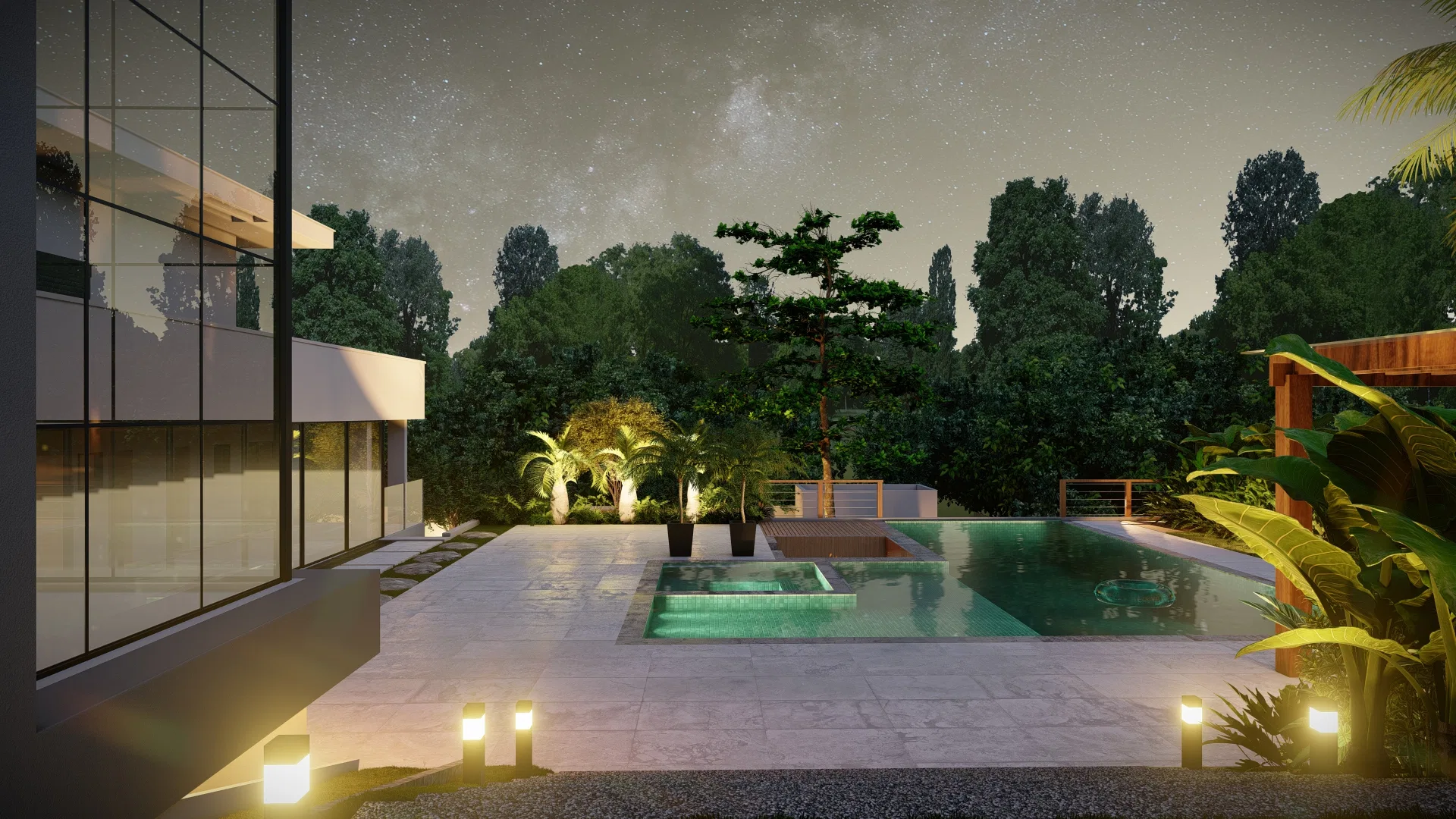 Pool integrated with a raised spa in front of the house's glazed facade, light stone paving and palm trees in the background, at night